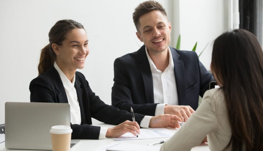friendly-team-members-chatting-laughing-together-during-office-break